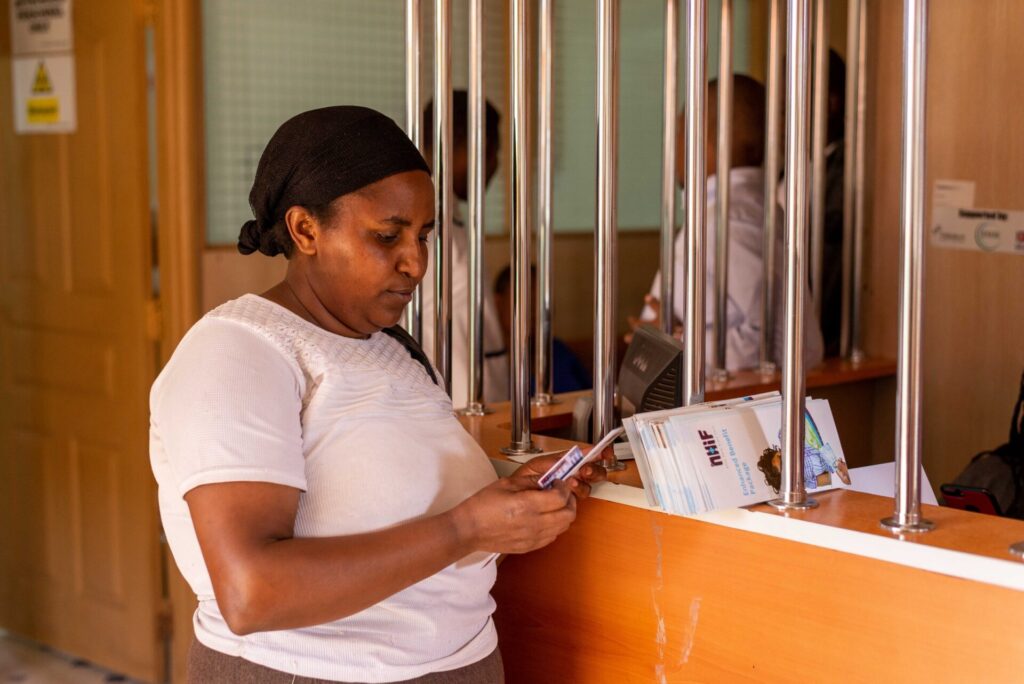 A PROFIT Financial Graduation participant in Samburu, Kenya visits a local NHIF facility.