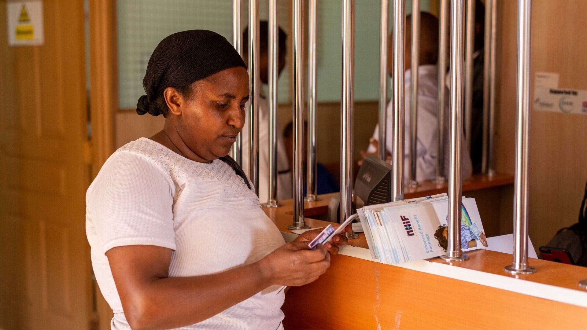 A PROFIT Financial Graduation participant in Samburu, Kenya visits a local NHIF facility.
